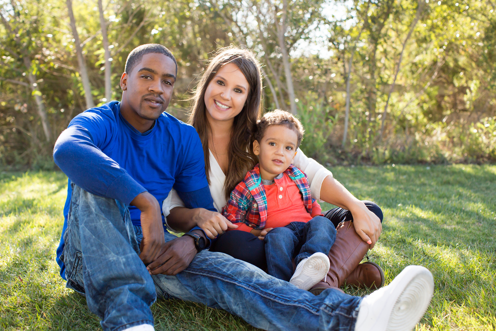 Multi cultural family together at the park